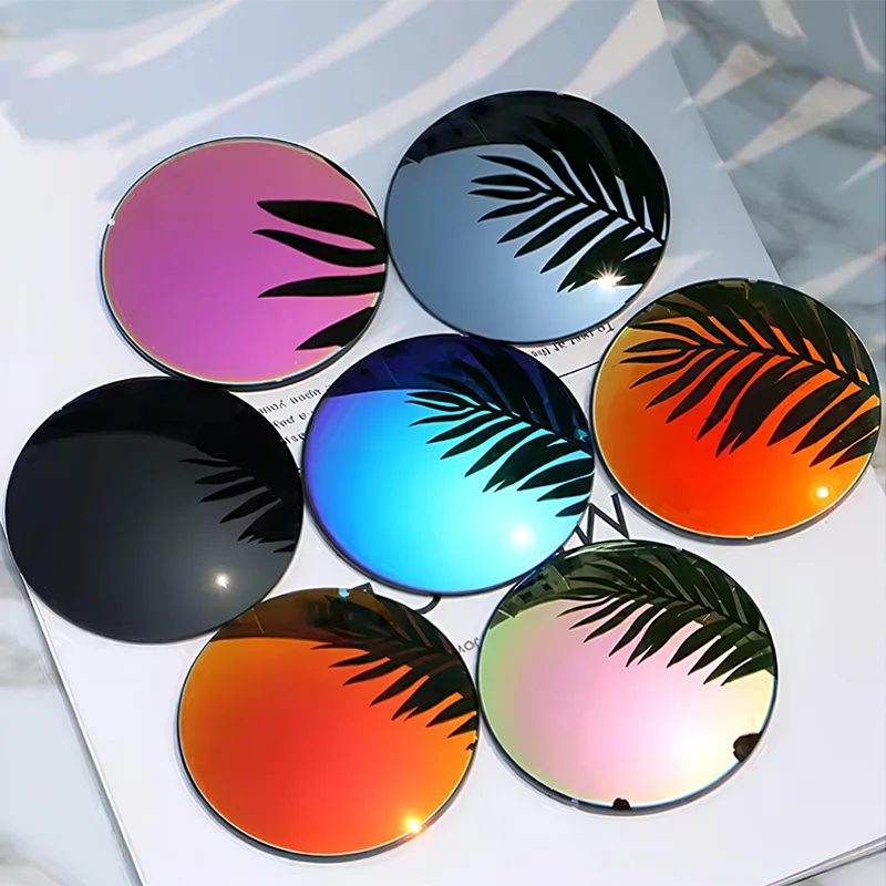 Six mirror-coated sun lenses in pink, blue, black, red, orange and purple with palm leaf reflections