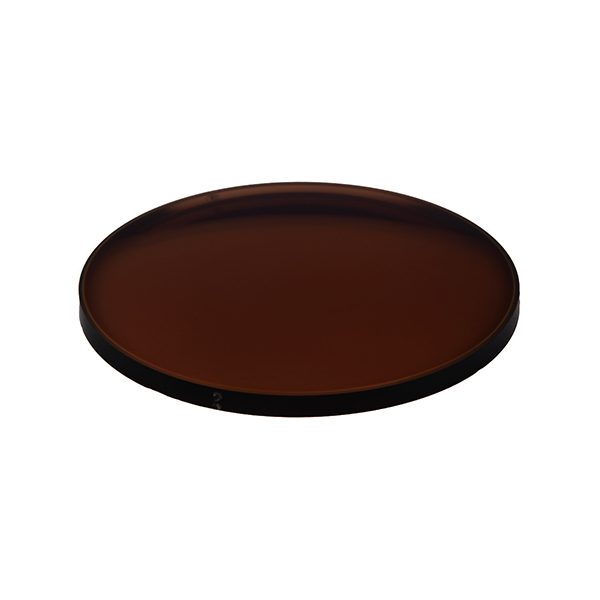 A darkened brown photochromic lens on a white background