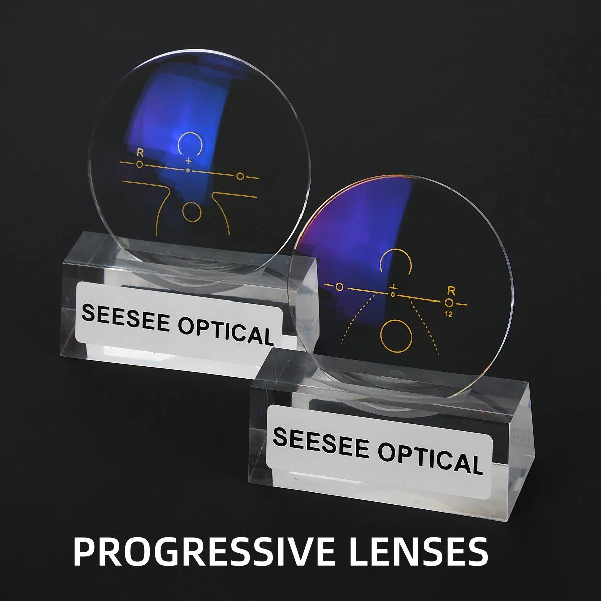 Two progressive lenses with yellow fitting marks standing in engraved acrylic blocks